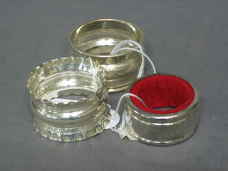 2 silver napkin rings and a silver plated wine bottle  coaster