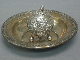 A circular Eastern embossed silver pepper raised on 3 bun feet together with a circular Sterling dish  5 1/2"
