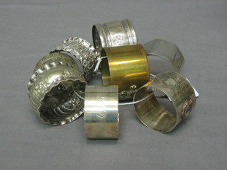 8 various silver plated napkin rings