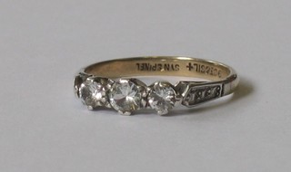 A 9ct gold dress ring set 3 diamonds