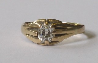 A yellow gold gypsy ring set a diamond