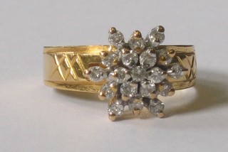 An 18ct gold dress ring set diamonds