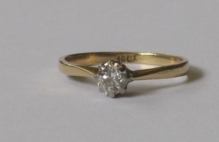 An 18ct dress ring set a solitaire diamond