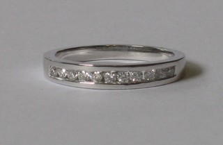 An 18ct white gold half eternity ring 