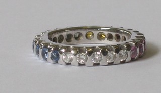 An 18ct full eternity ring set multi-coloured diamonds and other gem stones