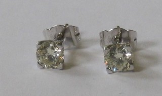A pair of diamond set ear studs approx 1.09ct 