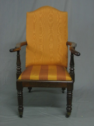 A handsome William IV rosewood open arm chair, raised on turned supports with upholstered seat and back (old break to arm)