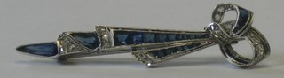 A white gold Art Deco ribbon shaped bar brooch sapphires and diamonds