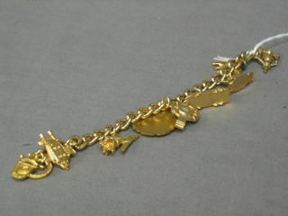 A gold plated curb link bracelet hung numerous gold plated Thunderbird related charms