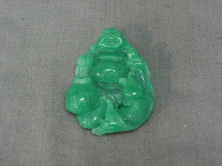 A carved green hardstone pendant in the form of a Buddha 1"