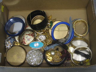 A collection of various compacts, wristwatches, bangles etc