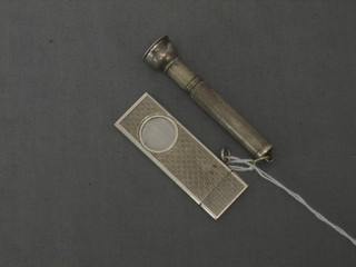 A silver cigar cutter and a silver cigar drill