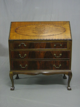 A Chippendale  style mahogany bureau, the fall front revealing a well fitted interior above 3 long drawers, raised on cabriole ball and claw supports 36"