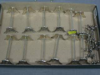 6 pairs of Continental silver plated knife rests and 5 silver plated knife rests