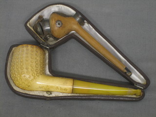 A carved Meerschaum pipe and 1 other