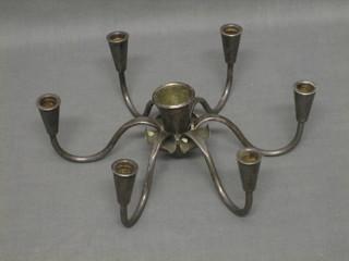 A metal 6 light candelabrum with recess to the centre