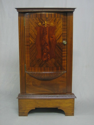 An Edwardian inlaid mahogany corner cabinet enclosed by a panelled door, raised on bracket feet 25" (made up)