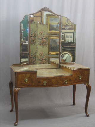 A 1930's serpentine fronted walnut dressing table with triple plate mirror above, fitted 1 long drawer flanked by 2 short drawers, raised on cabriole supports 45"