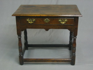 A 17th/18th Century style oak side table, fitted a frieze drawer and raised on turned and block supports 31"