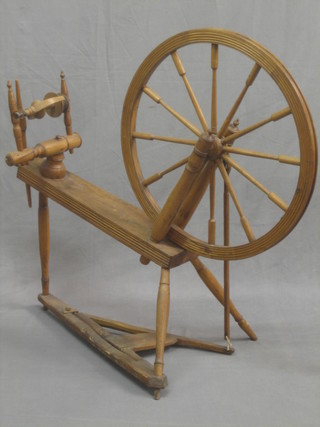 An old wooden spinning wheel