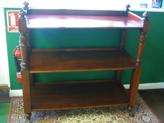 A Victorian mahogany 3 tier buffet with thre-quarter gallery, raised on turned and block supports 48"
