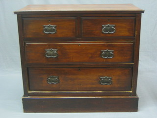 An Edwardian walnut chest of 2 short and 3 long drawers with plate drop handles, raised on a platform base 36"