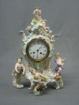 A 19th Century French striking mantel clock with porcelain dial and Roman numerals contained in a Meissen style porcelain case decorated cherubs 18"
