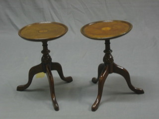 A pair of circular inlaid mahogany kettle or wine tables raised on pillar and tripod supports 9 1/2"