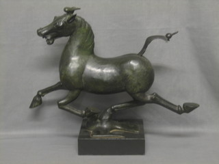 An Oriental bronze figure of a running horse raised on a black marble base 20"