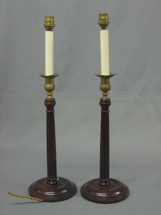 A pair of circular turned and fluted mahogany table lamps with gilt metal sconces 14"