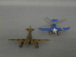 A model of a twin engined German aircraft and a model of a helicopter
