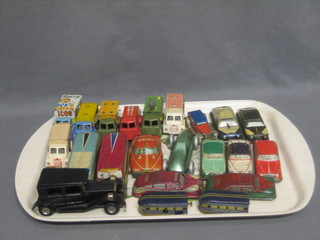 A collection of various tin plate toy cars