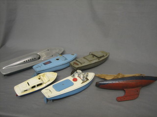 A Sutcliffe pressed metal model motor boat, do. Hornby, 2 pressed metal motor boats and a pressed metal yacht