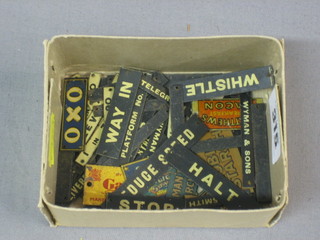 A box containing various miniature transfer railway signs, Platform 1, WH Smiths & Sons, Oxo, Cloak Room, Way Out etc, etc,