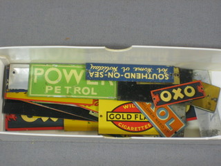 A rectangular box containing a good collection of various miniature platform advertising signs BP, Bovril, Oxo, etc, etc,