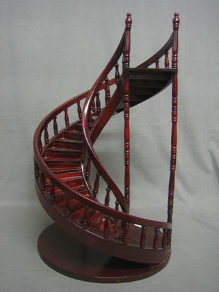 A mahogany Masonic style model of a winding staircase 23"