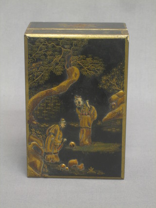 A chinoiserie style black lacquered cigarette box with hinged lid 6"