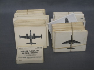 A yellow plastic box containing a collection of various aircraft mission cards