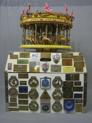 A handsome showman's carousel 18", raised on a stand with various show plaques