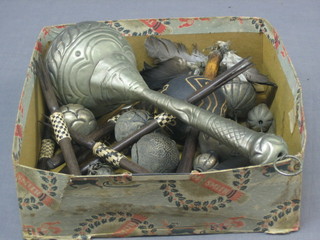 An Eastern white metal rattle, 1 other rattle, together with 2 clubs - "voo doo" items? 