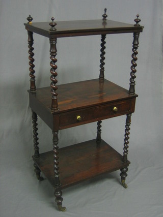 A Victorian rosewood 3 tier what-not fitted a drawer, raised on spiral turned supports and turned feet 21"