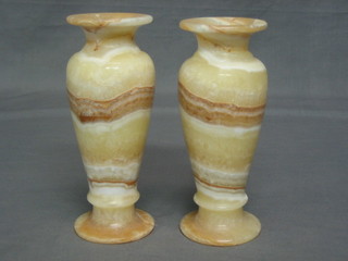 A pair of turned "alabaster" urns