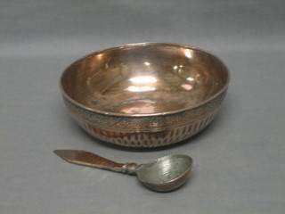 A circular Eastern copper dish together with a spoon 6"