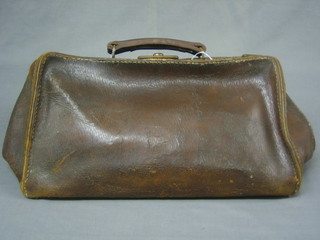 An old brown leather Gladstone bag