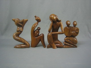 4 various carved wooden sculptures of naked ladies