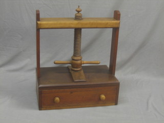 An 18th/19th Century oak and elm book press, the base fitted a drawer 25"