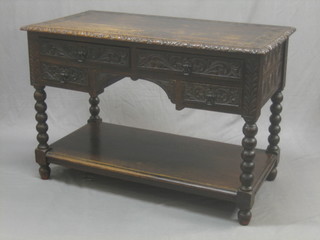 A Victorian carved oak side table fitted 2 long drawers above 2 short drawers with undertier, raised on turned supports 45"