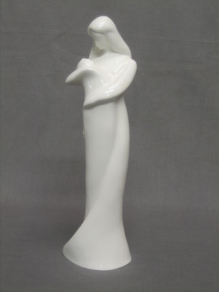 A Blanc de Chine Royal Doulton figure in the form of a standing mother and child 11"