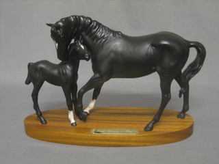 A Royal Doulton figure group - Black Beauty and Foal (matt finish) on a wooden base