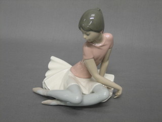 A Lladro figure of a seated ballet dancer, based impressed E-16M 6"
